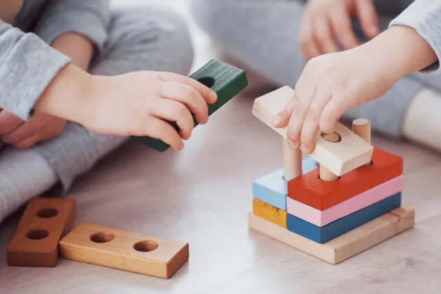 children-play-with-toy-designer-on-the-floor-of-the-children-s-room-two-kids-playing-with-colorful-blocks-kindergarten-educational-games (2)
