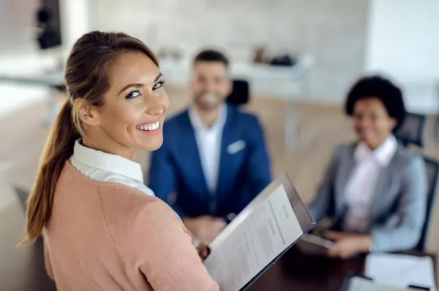 young-happy-woman-having-an-job-interview-in-the-office (1)